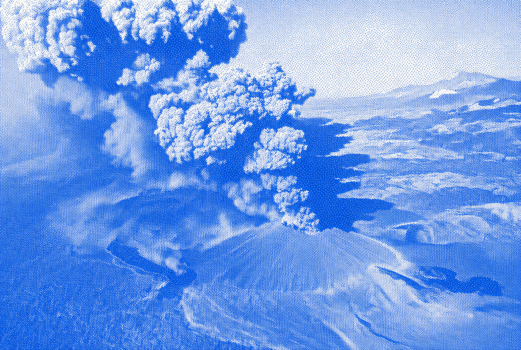 Blue halftone aerial view of an explosive volcanic plume spreading across the landscape.